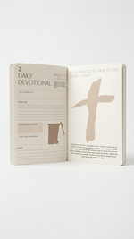 Open book with a cross illustration on a white background