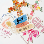 Decorative stickers with floral designs and motivational phrases on a white background