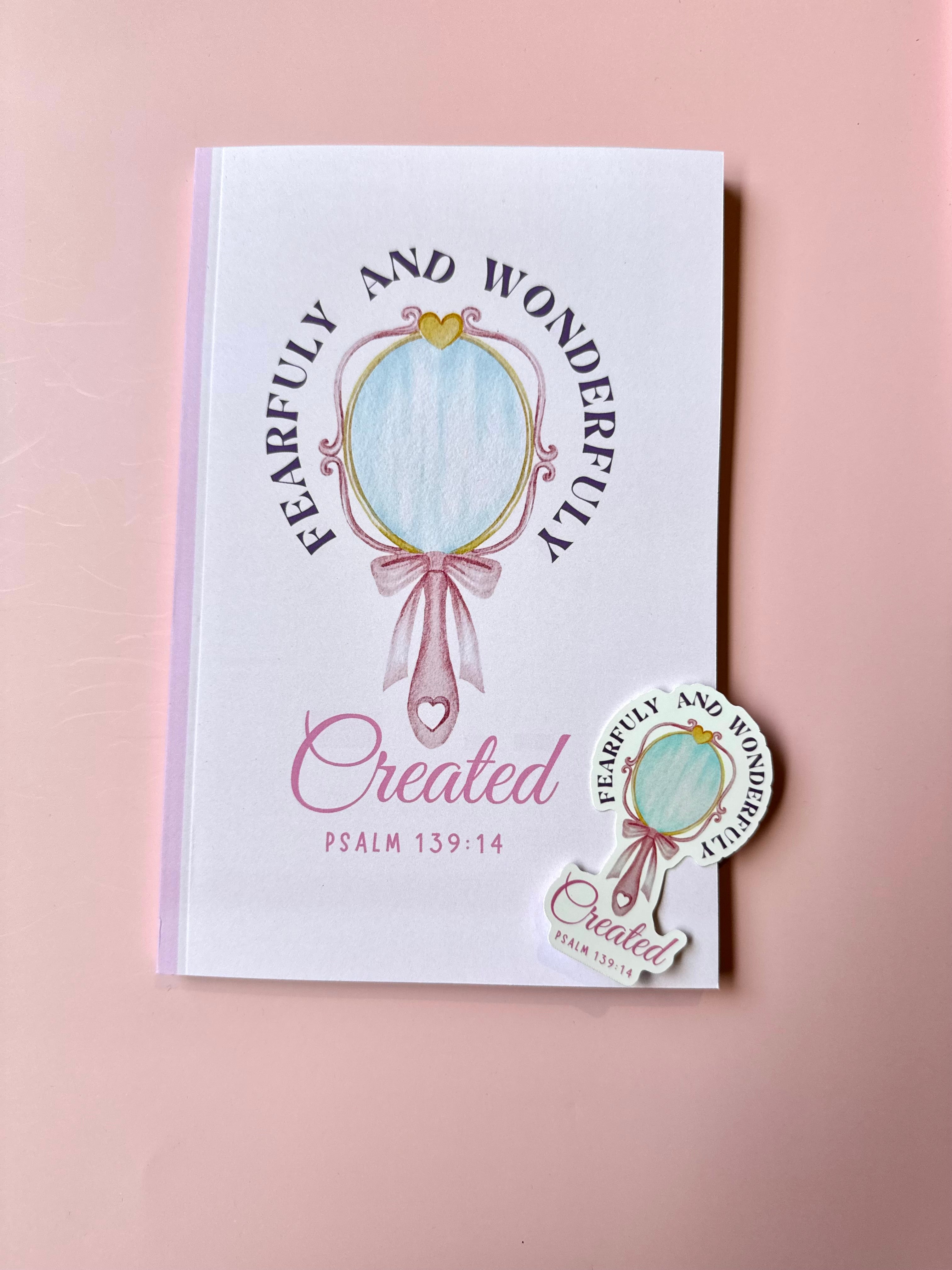 Book with 'Fearfully and Wonderfully Created' design on a pink background